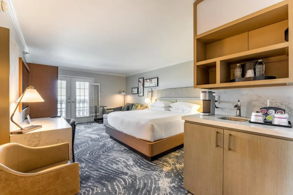 King room with a kitchenette, coffee maker and French doors at Crowne Plaza Orlando-Downtown