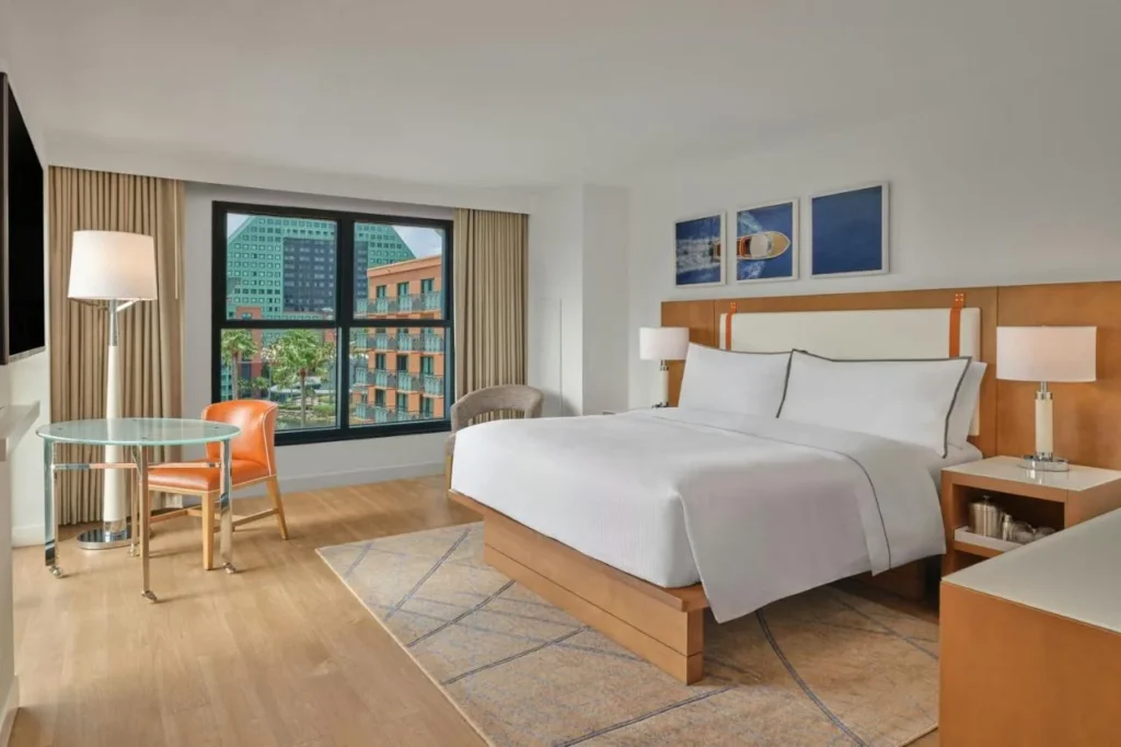 King room with a wood headboard and a window facing the Dolphin, Walt Disney World Swan