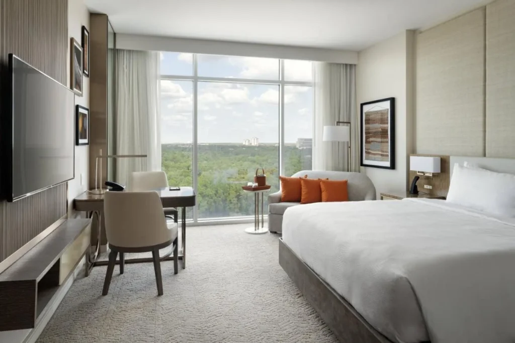 King room with floor-to-ceiling window over the trees at JW Marriott Orlando Bonnet Creek