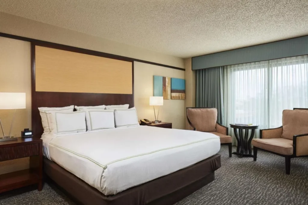 King room with two armchairs at the DoubleTree by Hilton Orlando Theme Park Resort