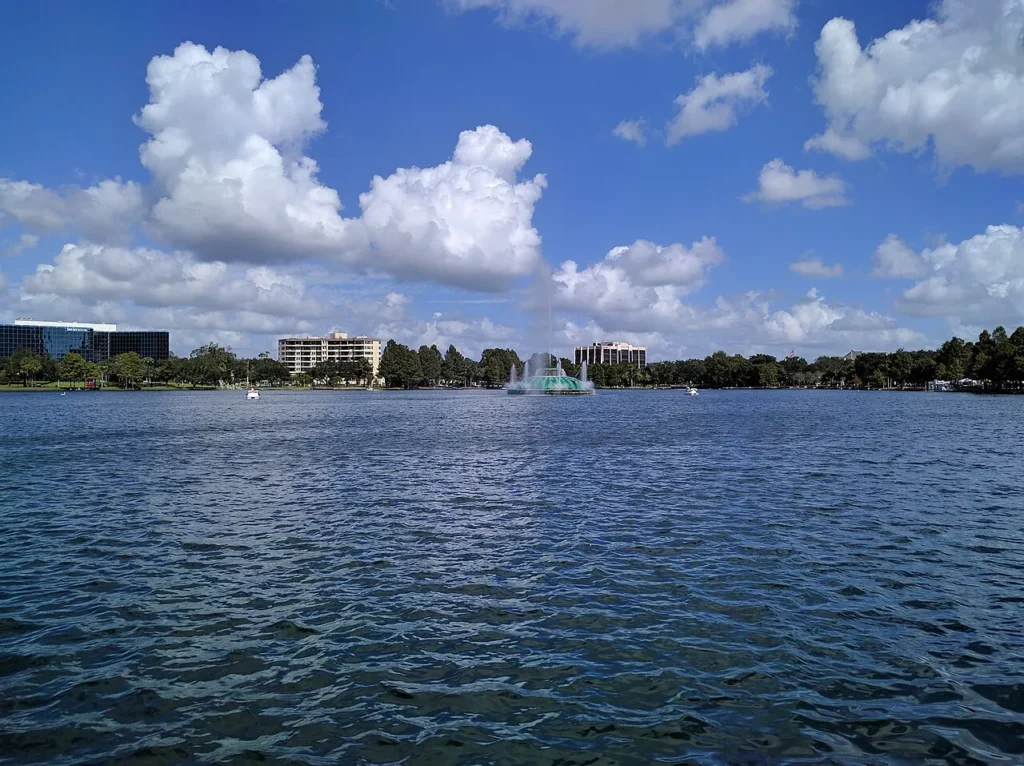 Lake Eola's fountain under puffy white clouds on an October afternoon in downtown Orlando