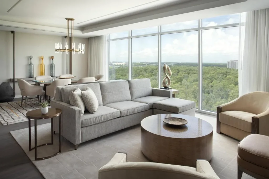 Large suite living area with sectional sofa and dining table at JW Marriott Orlando Bonnet Creek