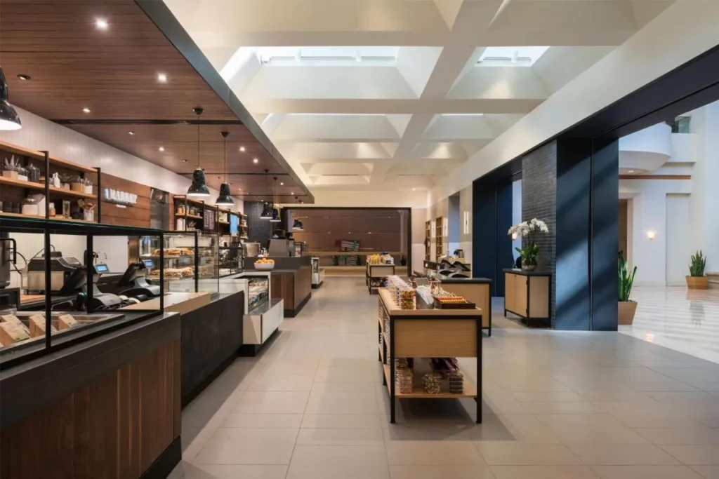 Lobby market and cafe counters under a skylit coffered ceiling at Hyatt Regency Orlando