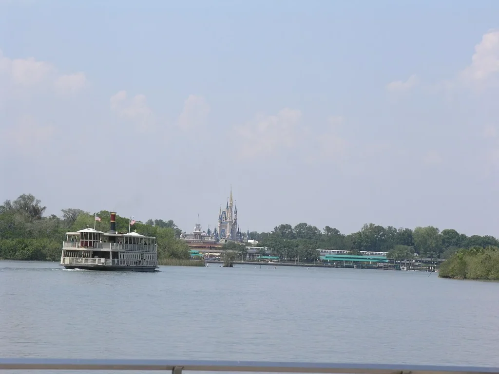 Magic Kingdom ferryboat crossing Seven Seas Lagoon with Cinderella Castle in the distance