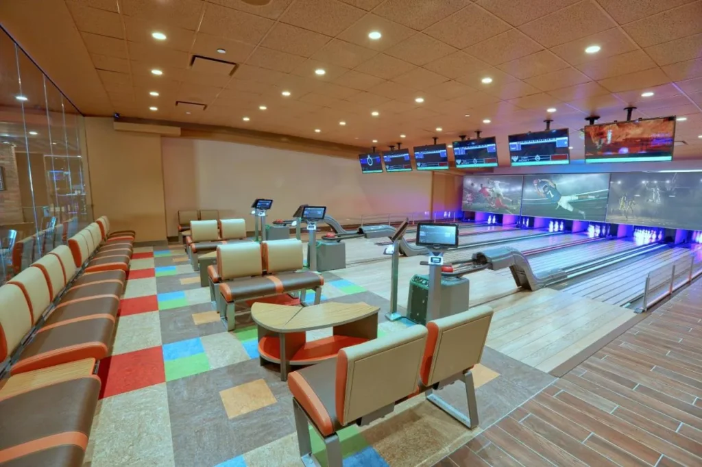 Mini bowling lanes with lounge seating and overhead screens at Drafts, Westgate Lakes Resort & Spa