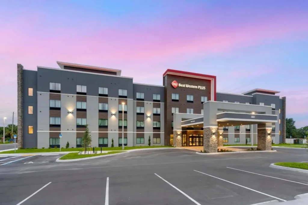 Modern exterior and parking lot at dusk, Best Western Plus Winter Haven Inn & Suites