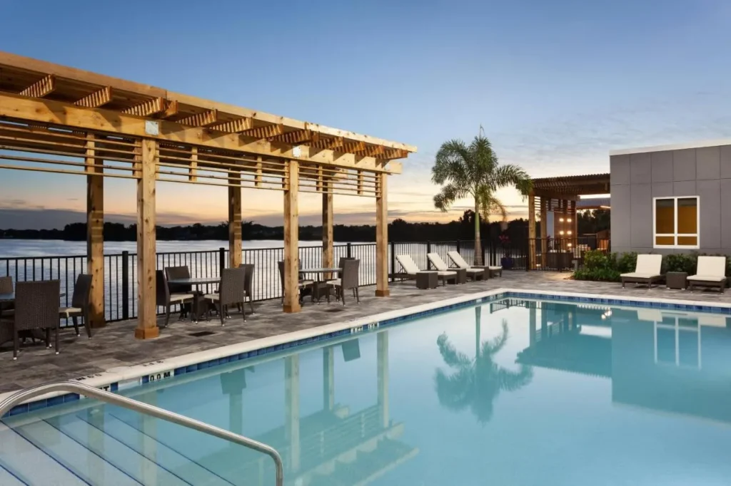 Outdoor pool and pergola overlooking Lake Dexter at sunset, Courtyard by Marriott Winter Haven