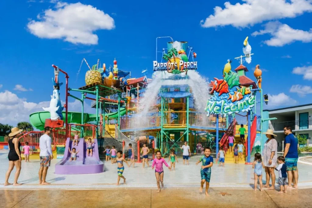 Parrot's Perch play structure with slides and a cascading water bucket at CoCo Key Orlando