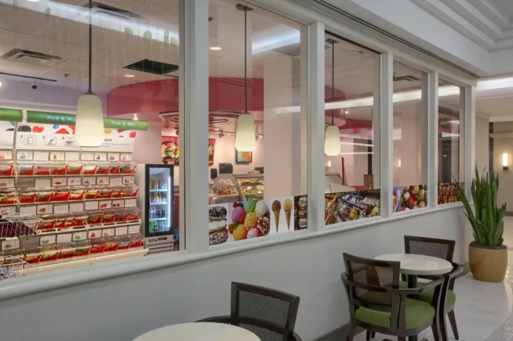 Pick-and-mix candy and ice cream shop behind windows at DoubleTree at the Entrance to Universal Orlando