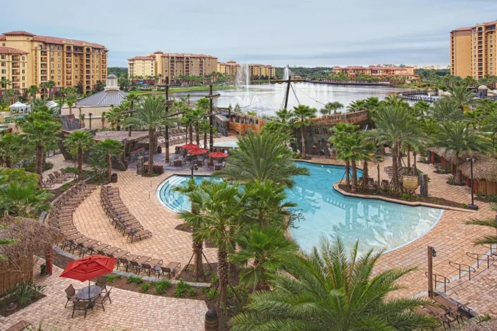 Pirate ship-themed pool beside the lake and condo towers at Club Wyndham Bonnet Creek