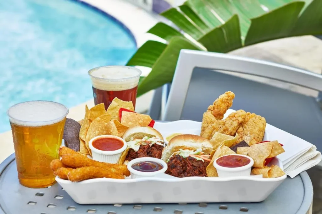 Poolside platter of sliders, mozzarella sticks, chicken tenders, chips and beers at SpringHill Suites Orlando at SeaWorld