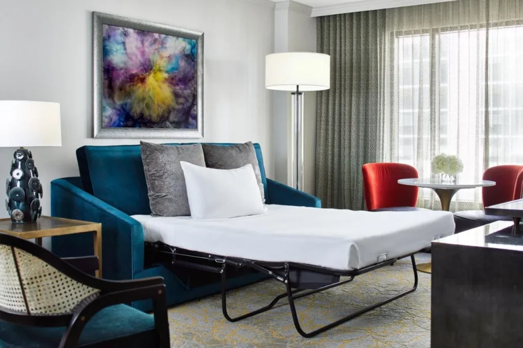 Pull-out sofa bed opened in a suite living area at Hotel Beauden in Orlando