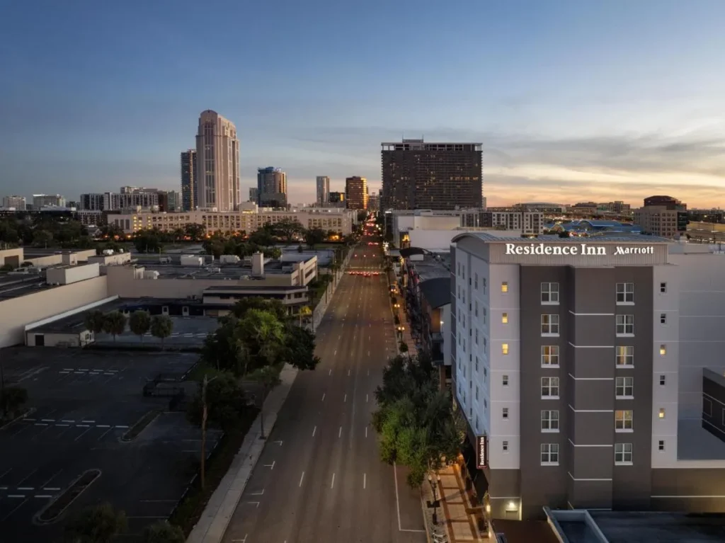 Residence Inn Orlando Downtown on North Orange Avenue at dusk with the downtown skyline