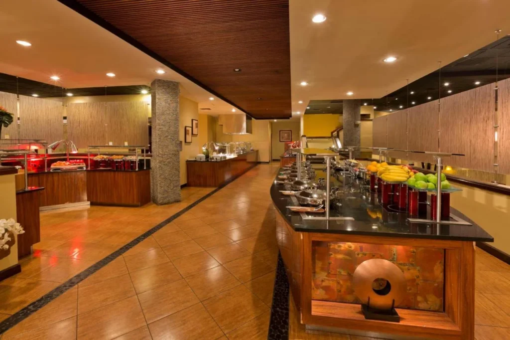 Restaurant buffet stations with fruit display at the DoubleTree by Hilton Orlando Theme Park Resort