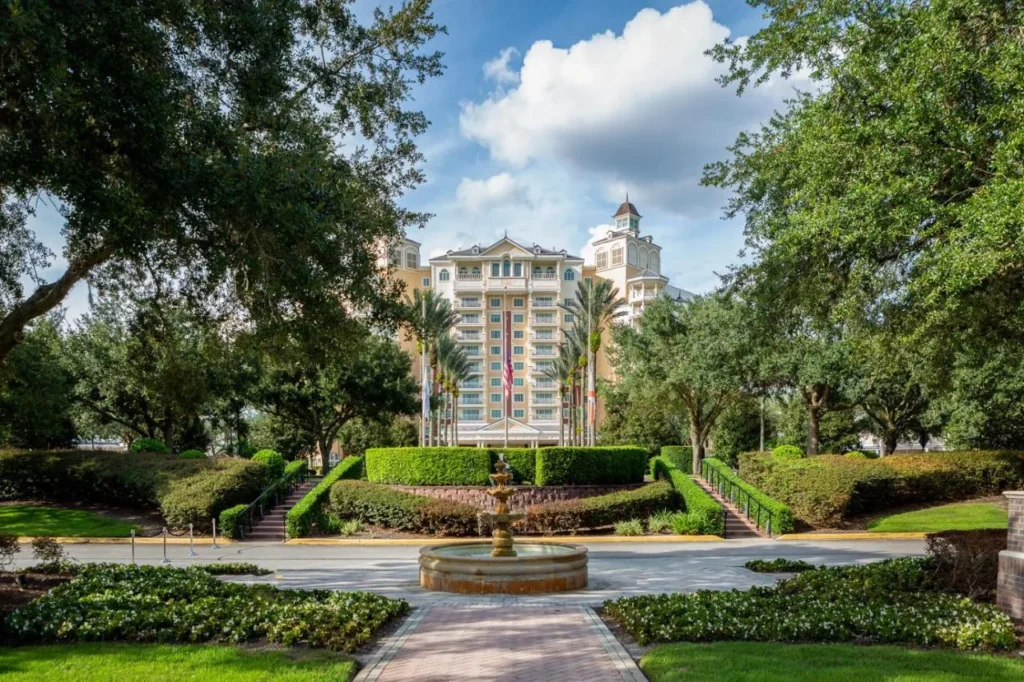 Reunion Grande tower behind a fountain and landscaped entrance gardens at Reunion Resort & Golf Club