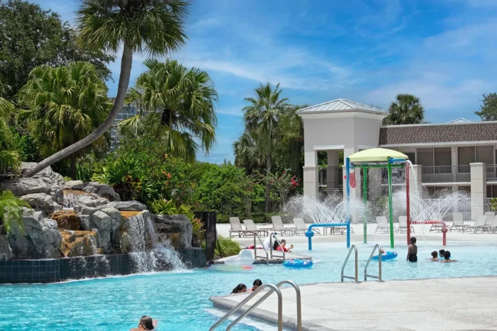 Rock waterfall and colorful splash play area in the pool at Wyndham I-Drive Avanti Resort