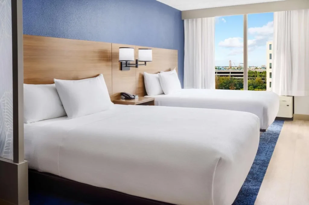 Room with two queen beds and a large window at Hyatt Place across from Universal Orlando
