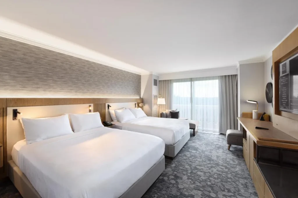 Room with two queen beds and a large window at JW Marriott Orlando Grande Lakes