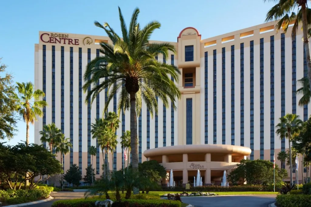 Rosen Centre Hotel tower and entrance drive framed by tall palm trees
