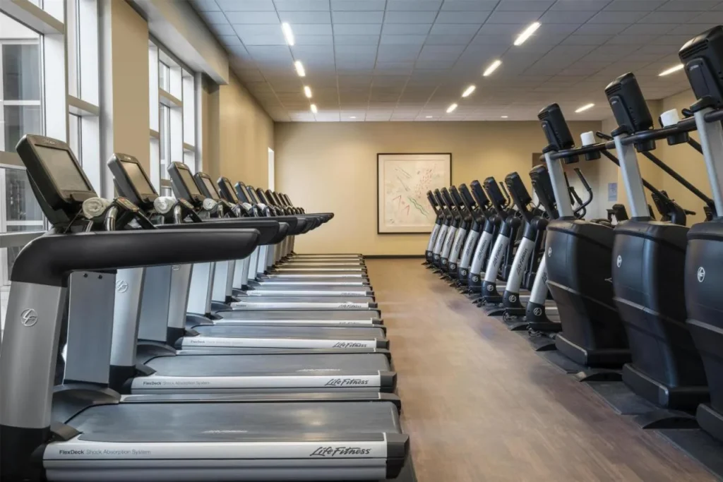 Rows of treadmills and elliptical machines in the Hyatt Regency Orlando StayFit fitness center