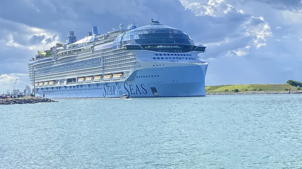 Royal Caribbean's Star of the Seas sailing out through the Port Canaveral channel past the jetty