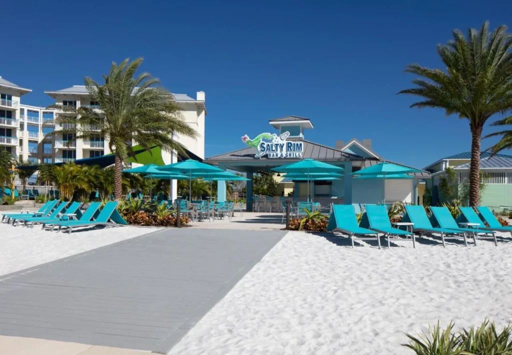 Salty Rim Bar & Grill with turquoise loungers on white sand at Margaritaville Resort Orlando