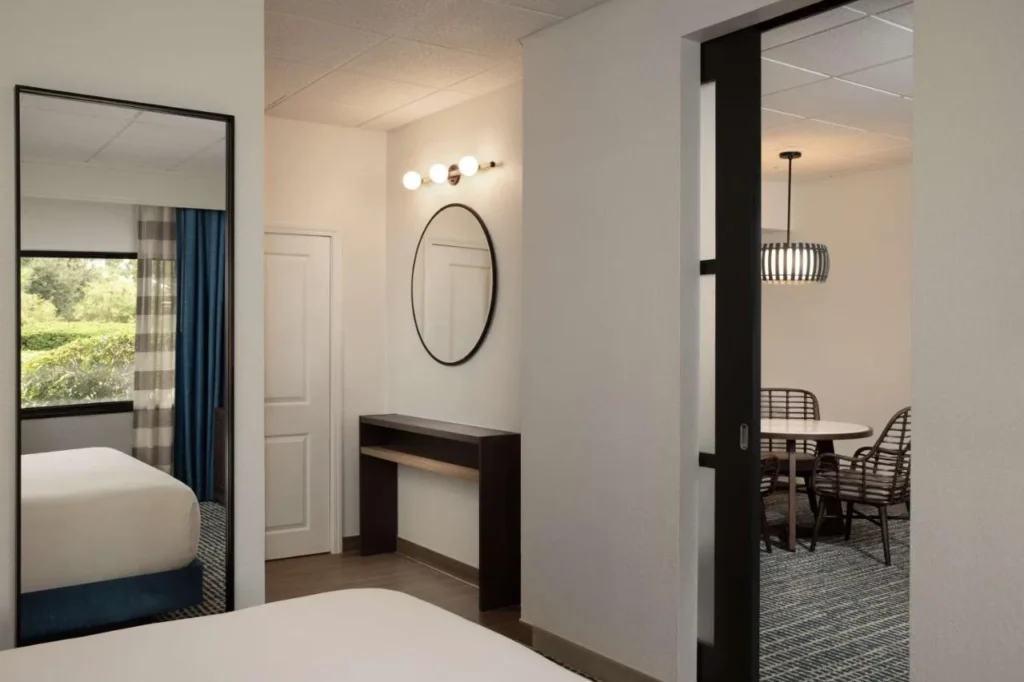 Sliding barn door between bedroom and dining area at DoubleTree Suites Disney Springs