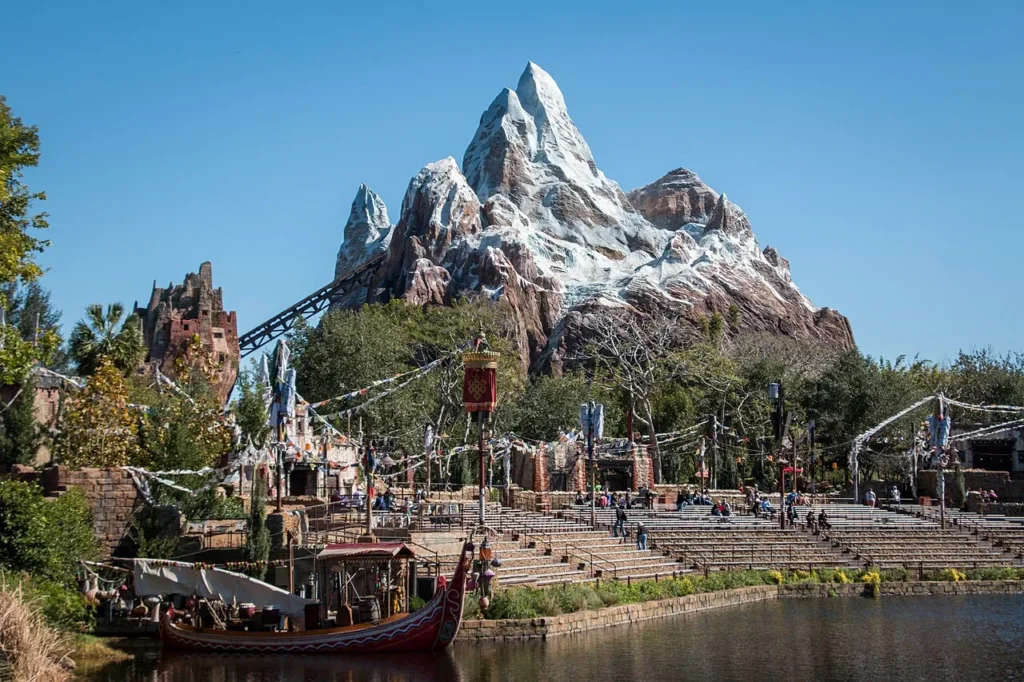 Snow-capped Expedition Everest mountain and coaster track rising over the lake at Disney's Animal Kingdom