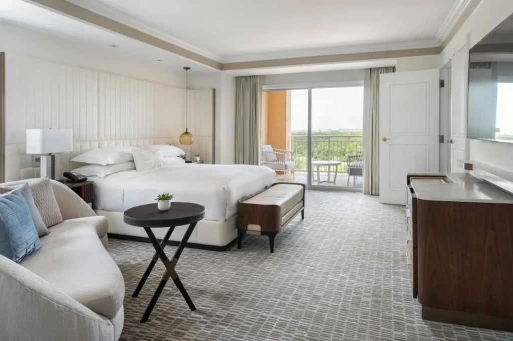 Spacious king room with sofa and balcony at The Ritz-Carlton Orlando, Grande Lakes