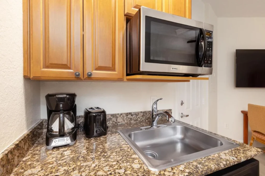 Studio kitchenette with microwave, coffee maker, toaster and sink at Westgate Vacation Villas Resort