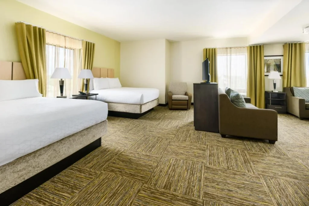 Studio suite with two queen beds and a sofa at Candlewood Suites Lake Buena Vista