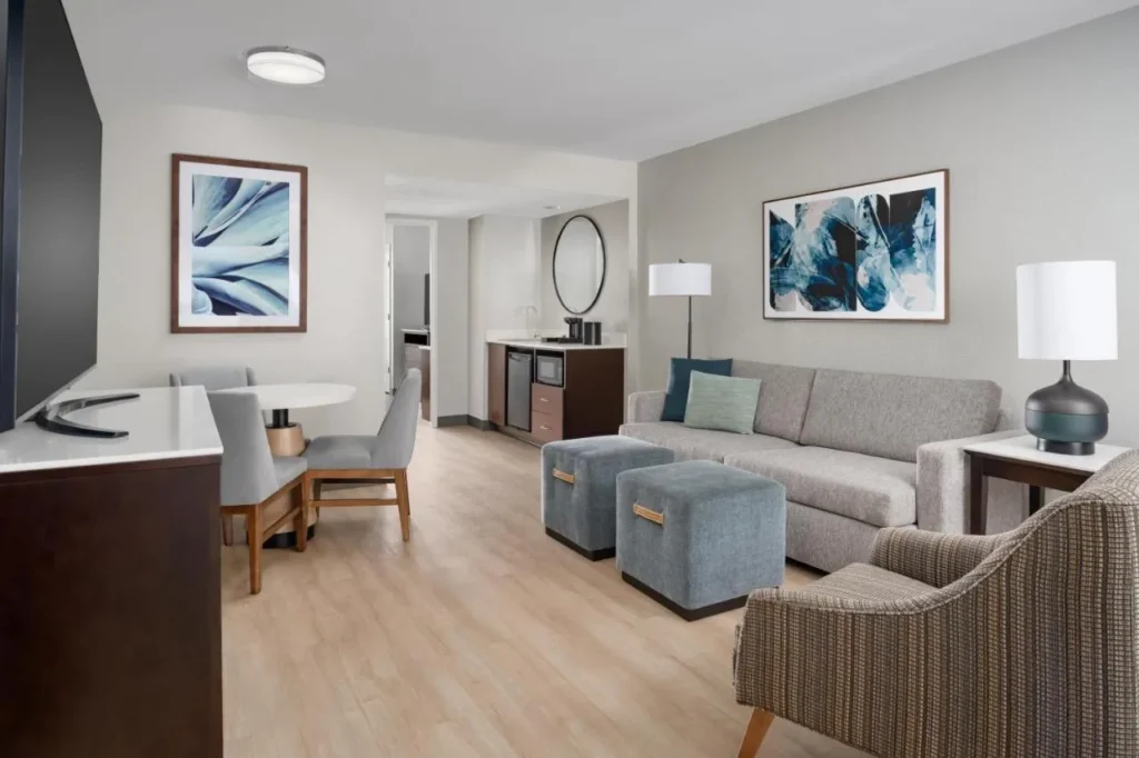 Suite living room with sofa, dining table and wet bar, Embassy Suites Lake Buena Vista Resort