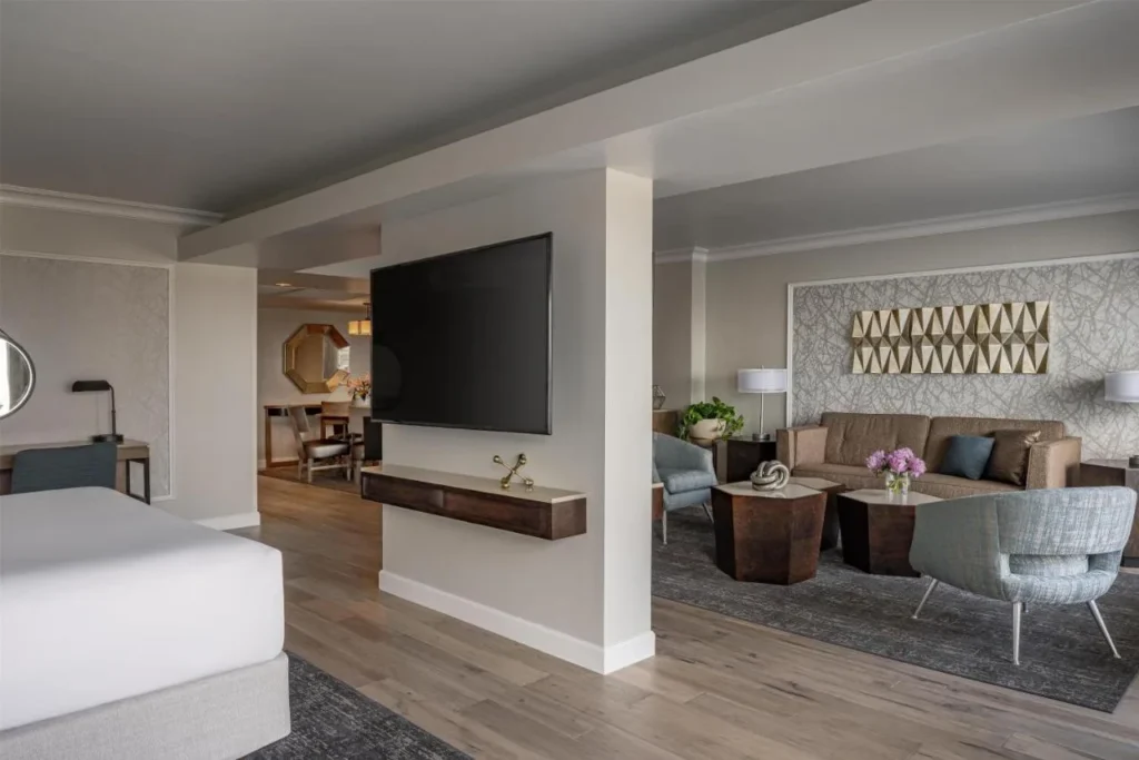 Suite with a king bed and separate lounge area at Hyatt Regency Orlando International Airport