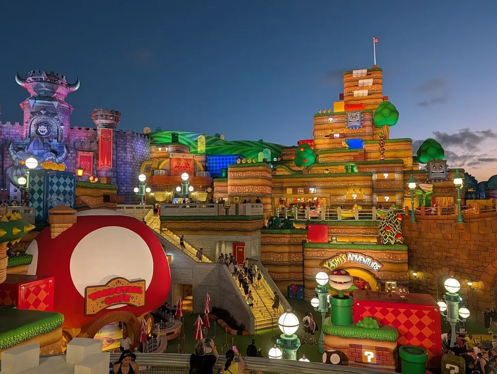 Super Nintendo World at dusk with Bowser's castle, Toadstool Cafe and Yoshi's Adventure, Epic Universe