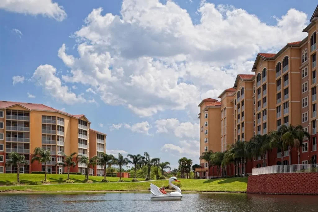 Swan paddle boat on the lake below villa towers at Westgate Town Center Resort