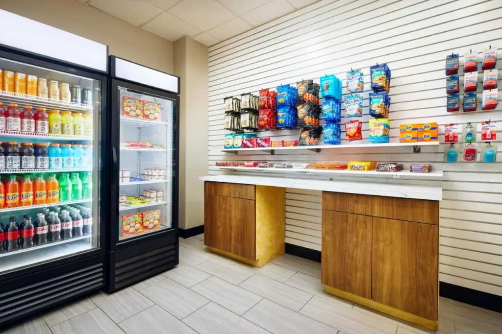 The Pantry shop with drink coolers, snacks and essentials at Staybridge Suites Orlando Royale Parc