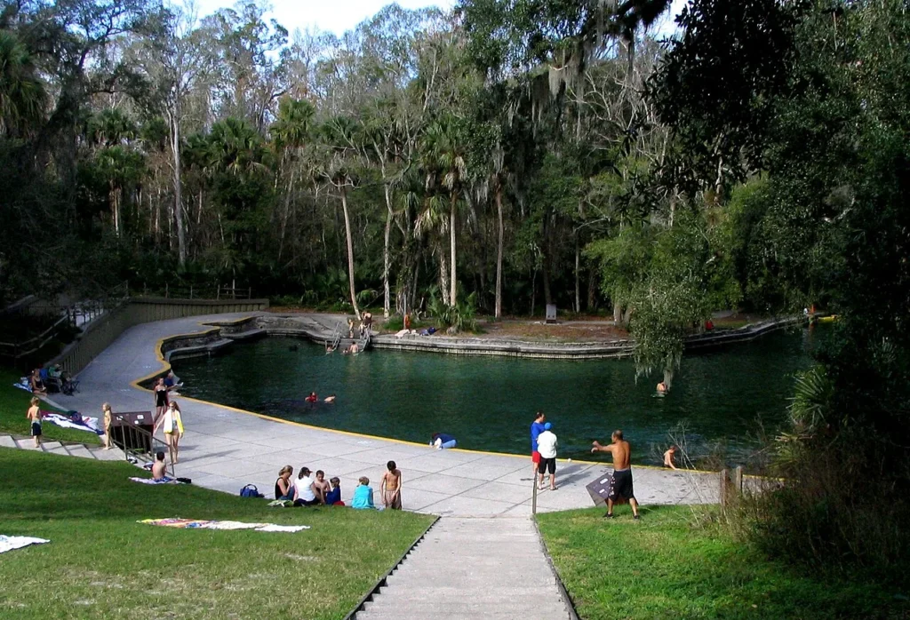 The walled spring basin, swimming steps and grassy slope at Wekiwa Springs State Park