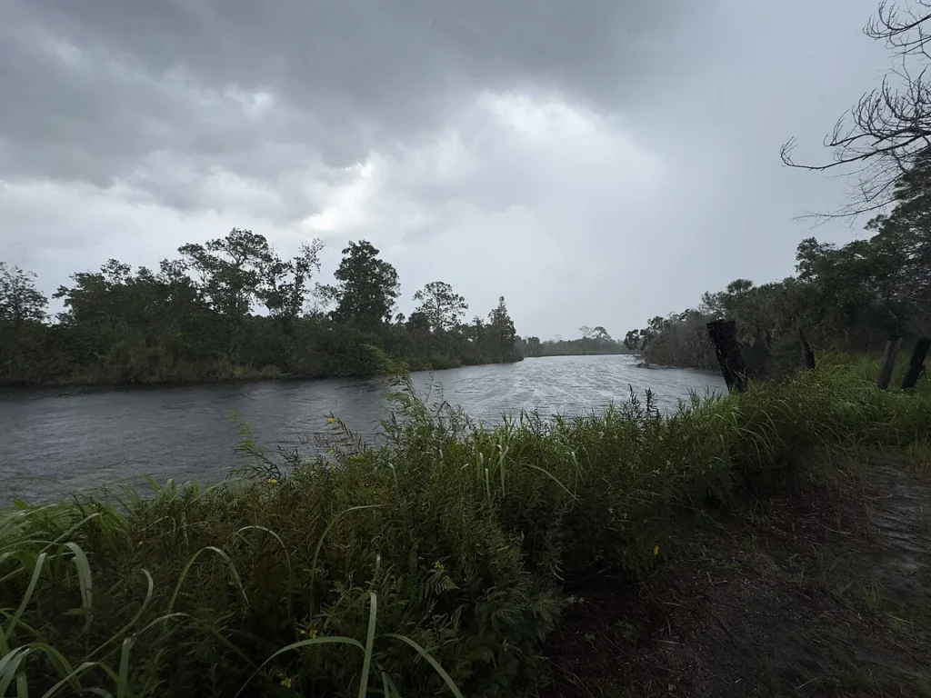Thunderstorm clouds and heavy rain over the Little Manatee River in Florida's Tampa Bay area