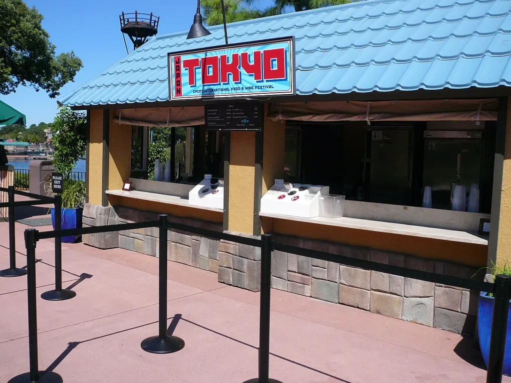 Tokyo marketplace booth with a blue tiled roof at EPCOT's International Food & Wine Festival