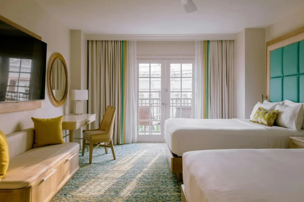 Two-queen room with French doors to a balcony at Gaylord Palms Resort & Convention Center