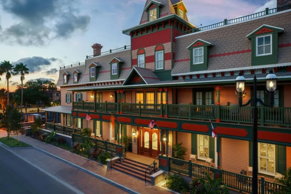 Victorian-style facade and long verandas of Renaissance St. Augustine Historic Downtown Hotel at sunset