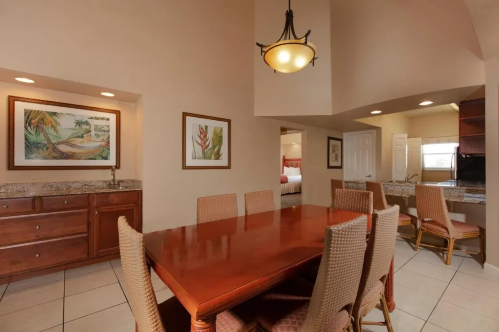 Villa dining area with wood table, wet bar and breakfast counter at Westgate Town Center Resort