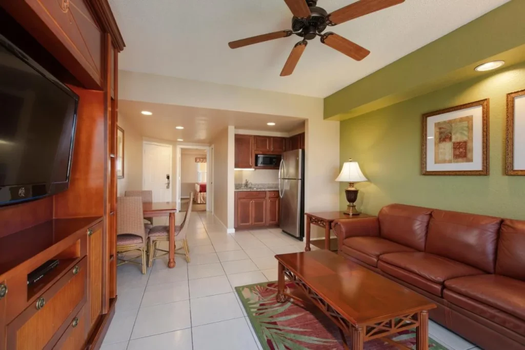 Villa living room with leather sofa, dining table and kitchen at Westgate Town Center Resort