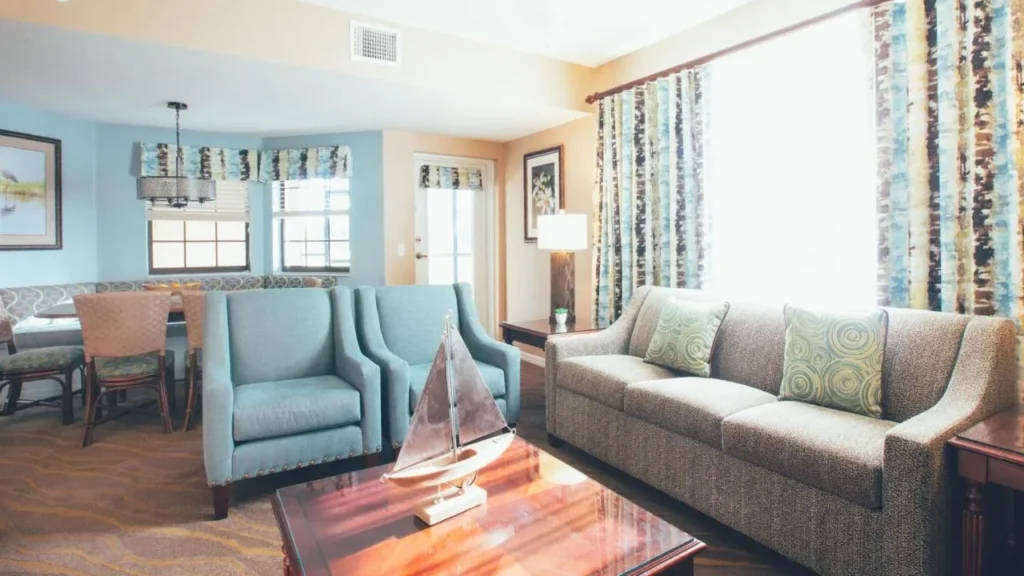 Villa living room with sofa and dining nook at Orange Lake Resort in Kissimmee