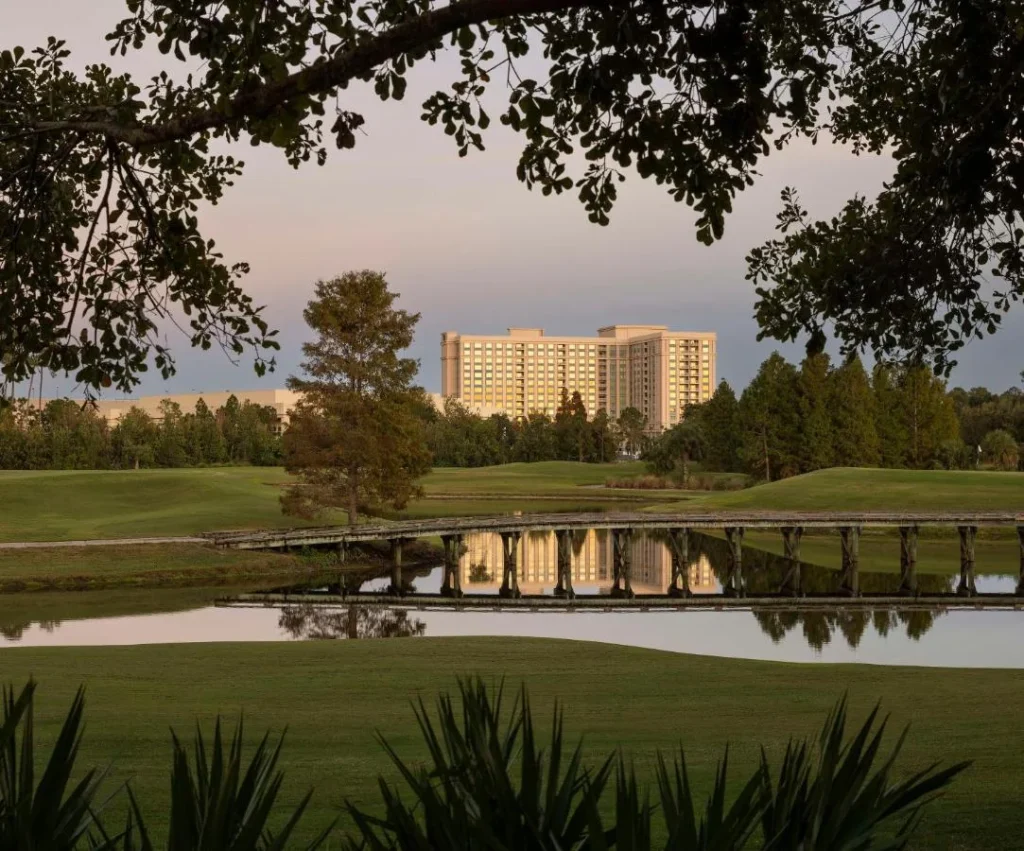 Waldorf Astoria Golf Club fairway, pond and wooden footbridge at dusk, Waldorf Astoria Orlando