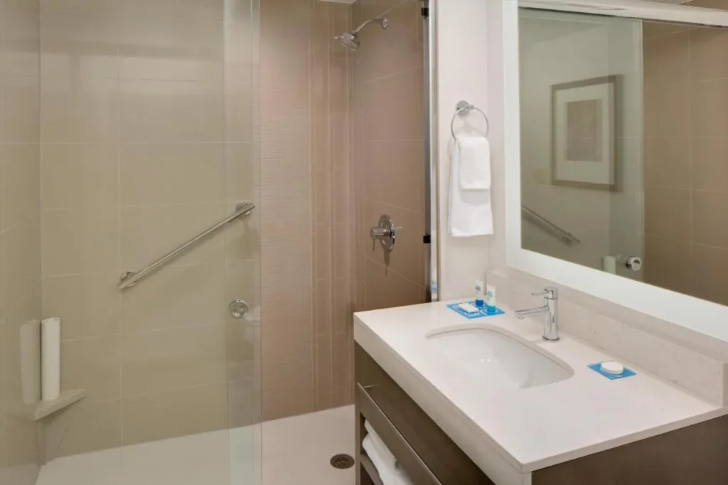 Walk-in shower bathroom with vanity at Hyatt House across from Universal Orlando Resort
