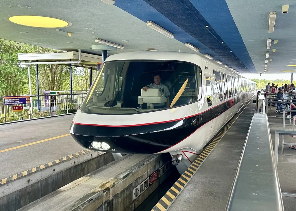 Walt Disney World monorail arriving at the Transportation and Ticket Center platform for Magic Kingdom