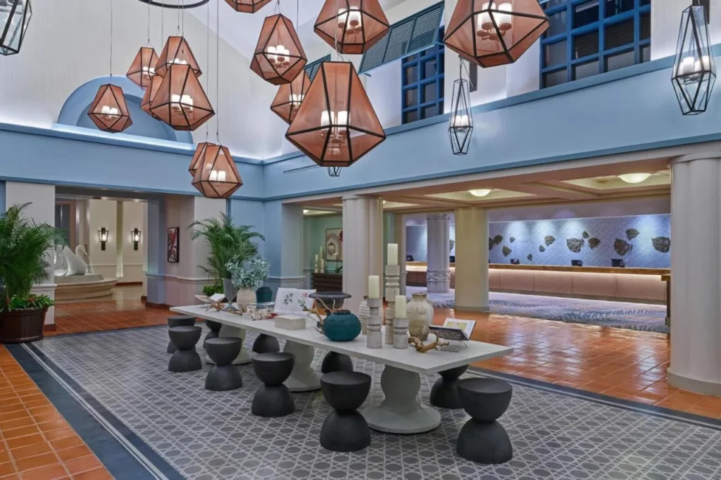 Walt Disney World Swan lobby with copper lanterns, a long table and a swan fountain