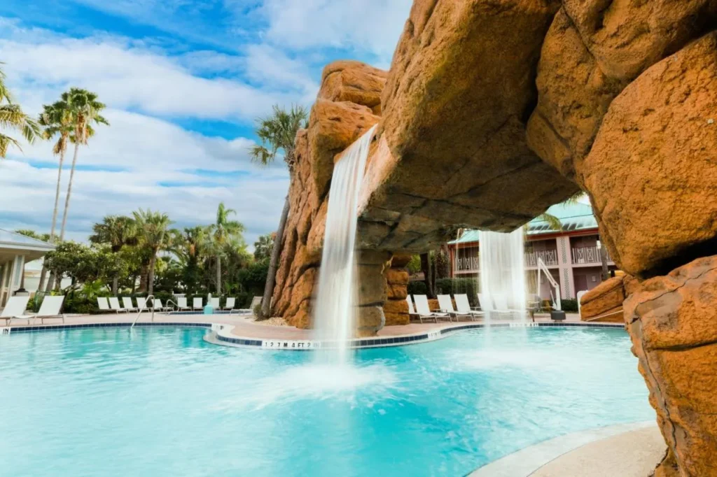 Waterfall pool with rock arches and palm trees at Radisson Resort at the Port in Cape Canaveral