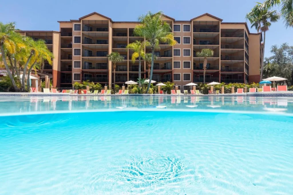 Westgate Lakes Resort and Spa pool in front of a villa building with balconies